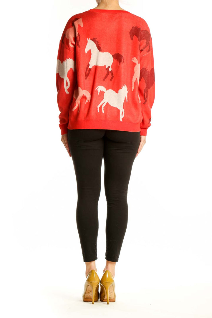 Back view of red horse print knit sweater showing full animal print design