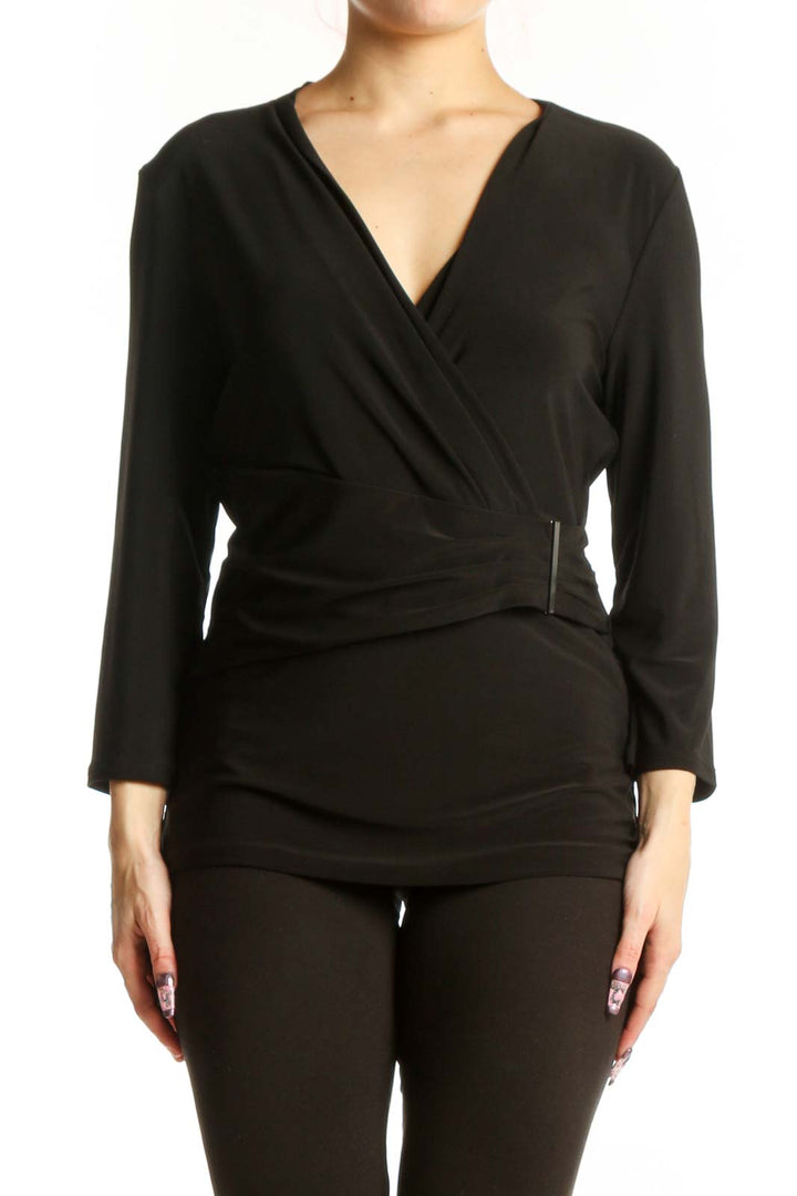 Black wrap long sleeve top with V-neckline and metallic waist detail, front view