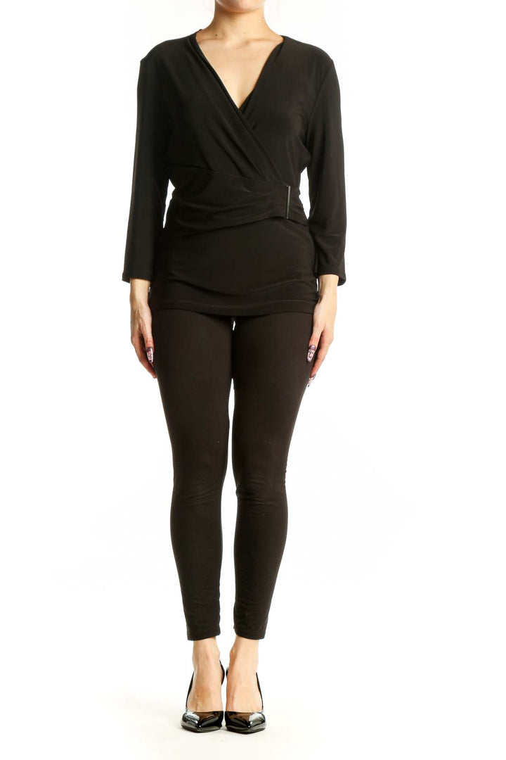 Black wrap long sleeve top with V-neckline and metallic waist detail, front view