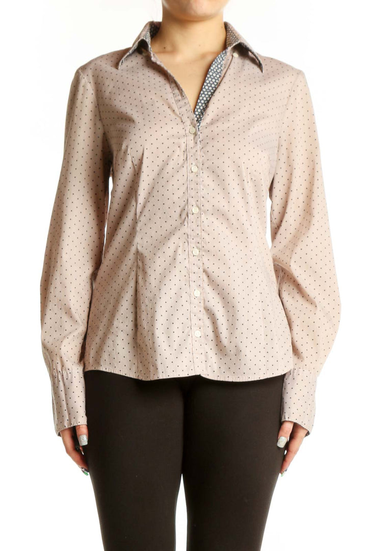Beige polka dot button-up blouse with long sleeves and collared neckline, front view