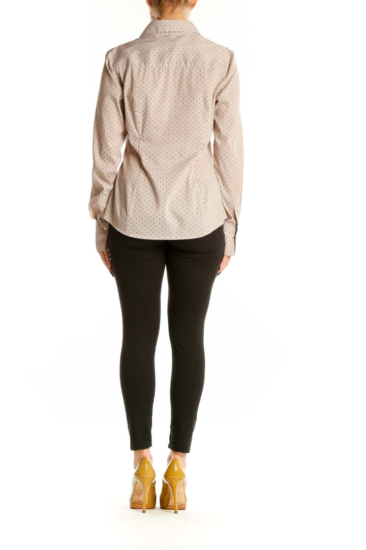 Beige polka dot button-up blouse back view showing fitted silhouette and button-down design