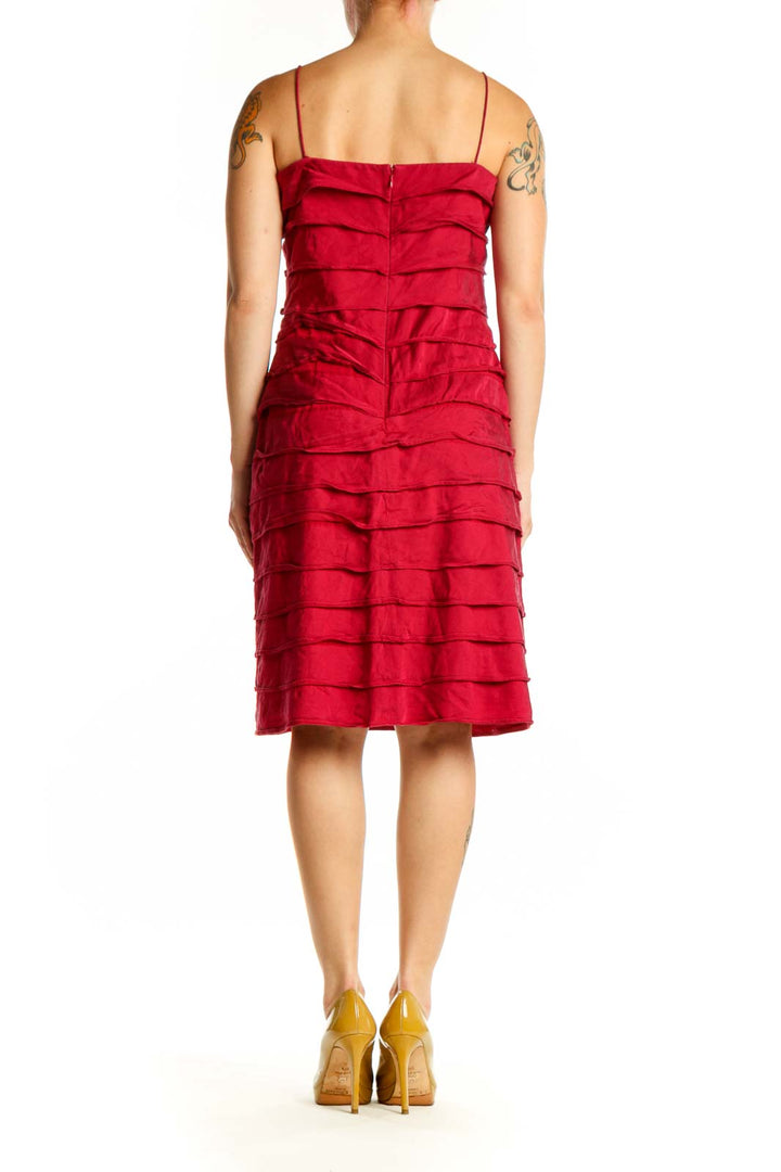 Red ruched midi cocktail dress with spaghetti straps, back view