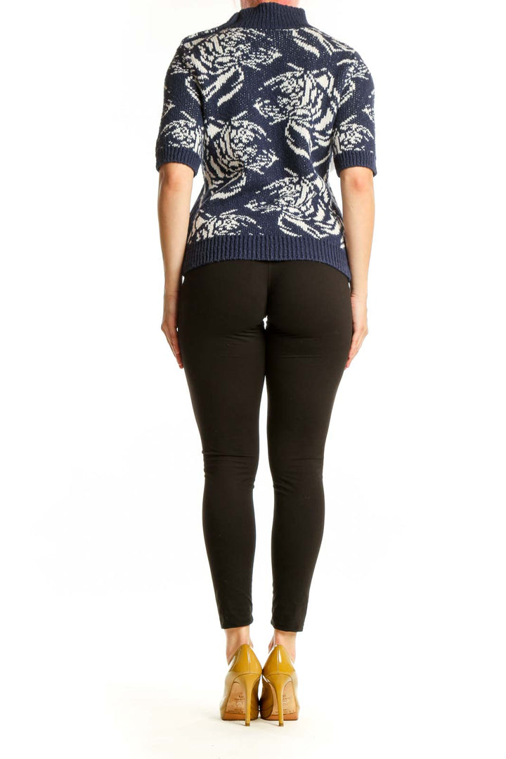 Navy floral jacquard turtleneck sweater with cream botanical pattern, back view