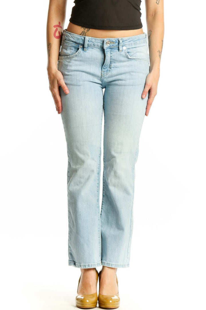 Front view of light blue denim flare jeans by WE THE FREE, size M, featuring mid-rise fit and classic light wash