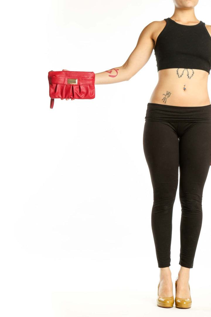 Red leather pleated clutch with gold-tone metal plate detail and wristlet strap by Juicy Couture