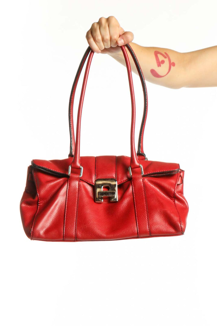 Red leather shoulder bag with pleated detailing and gold-tone hardware held by model