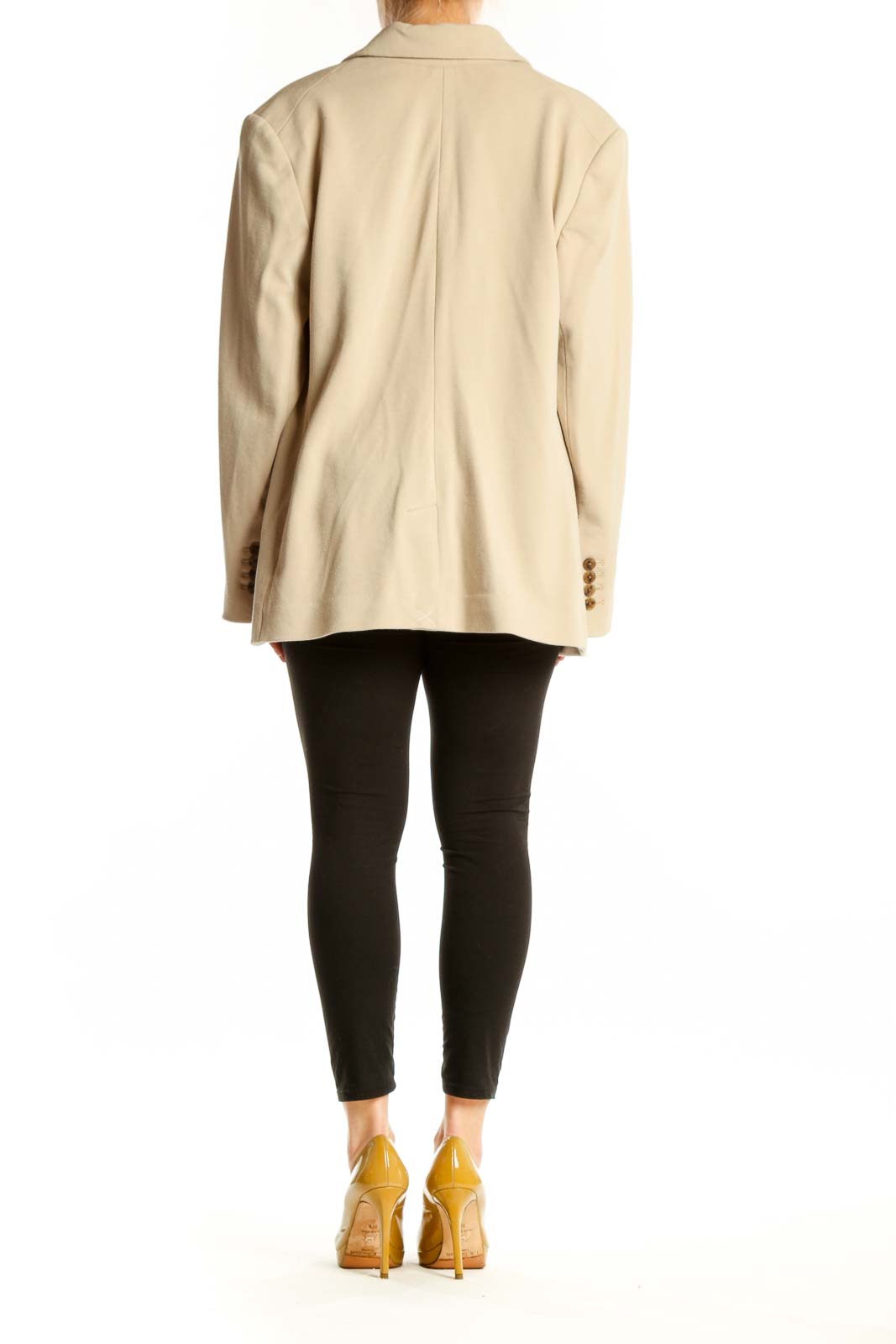 Cream double-breasted blazer with brown buttons, back view on model