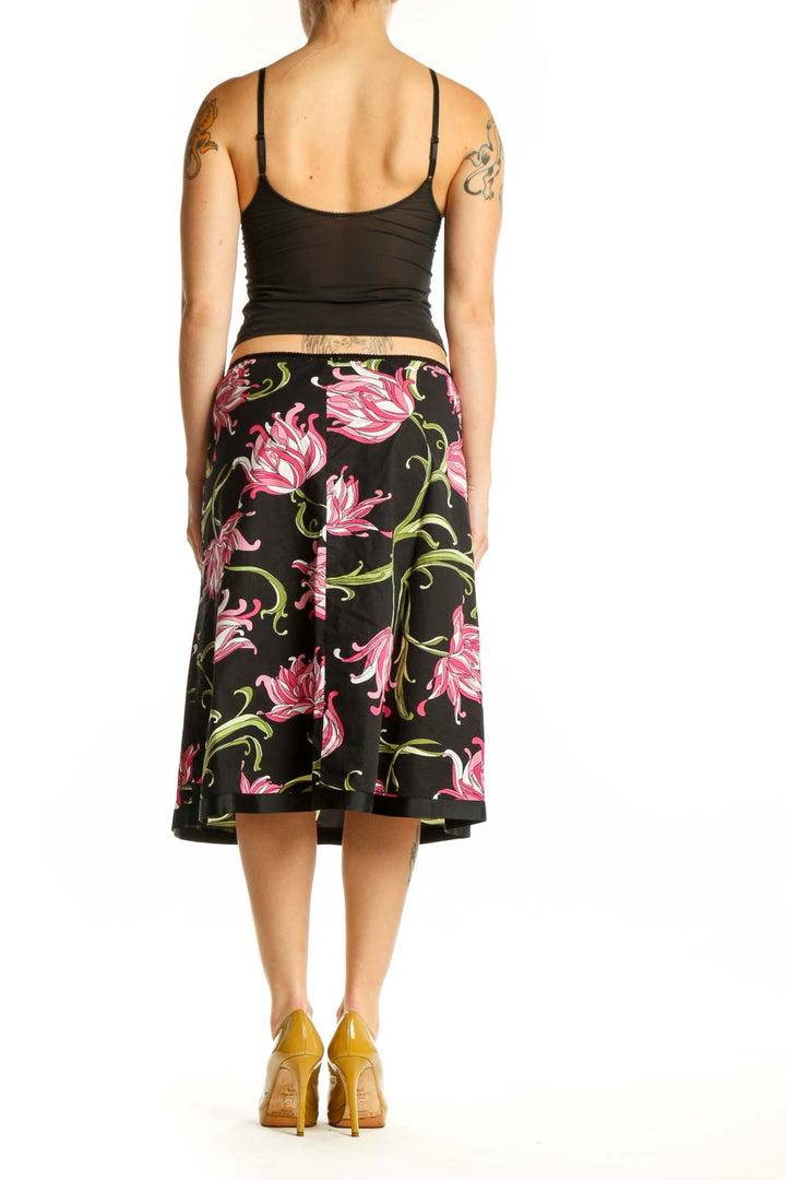 Black floral A-line midi skirt with pink flowers and green foliage, back view