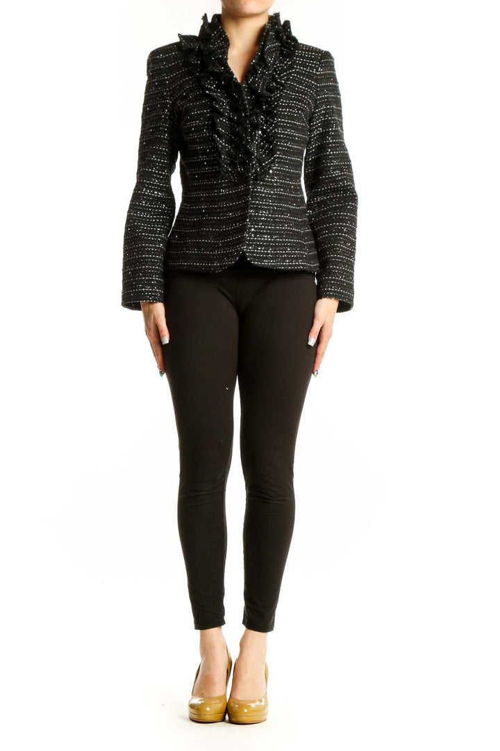 Black studded blazer jacket with rhinestone embellishments and ruffled collar, front view