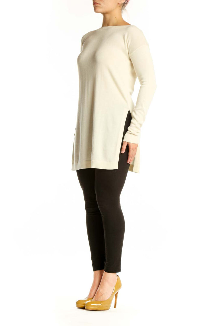 Cream modal pima cotton long sleeve knit with boat neckline, front view on model