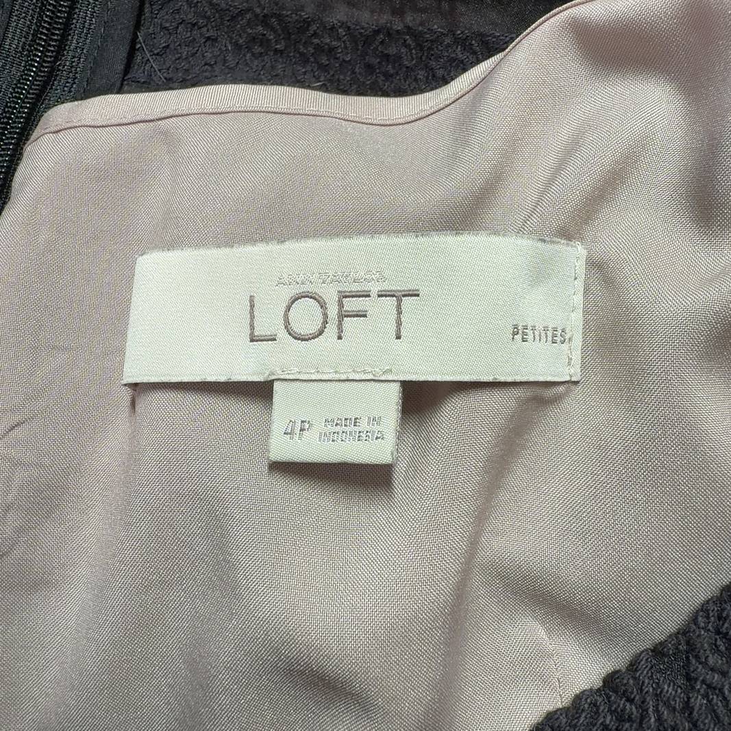 Black striped short sleeve fit and flare dress with crew neckline and A-line skirt, back view