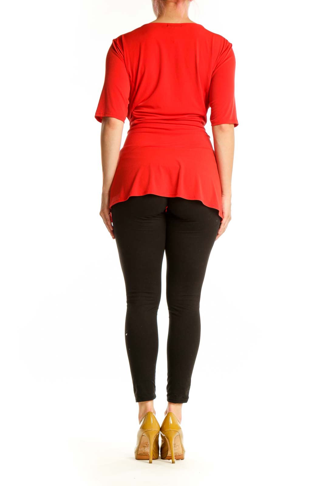 Red wrap blouse with tie waist detail, back view on model wearing black pants