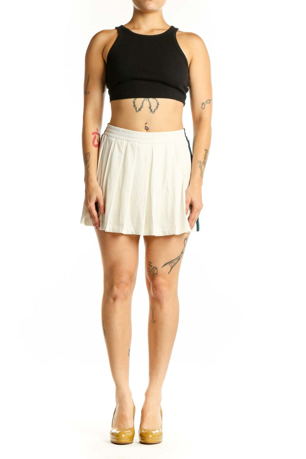 Cream pleated athletic skirt front view, TORY SPORT activewear XS with elastic waistband