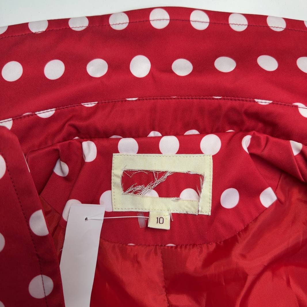 Red and white polka dot wrap coat with tie-belt waist, back view