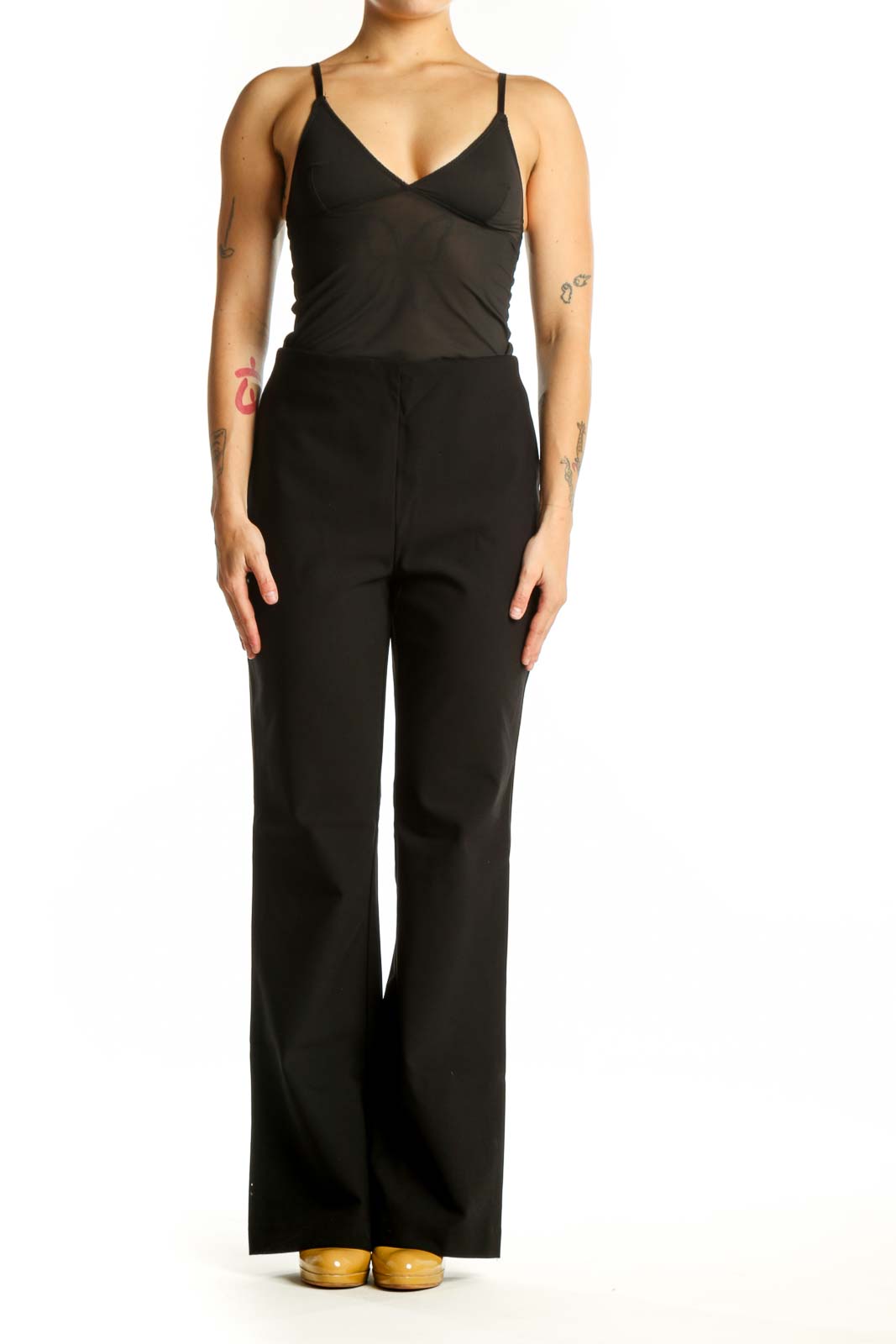 Black flare pants with high-waisted silhouette and stretchy fabric, front view
