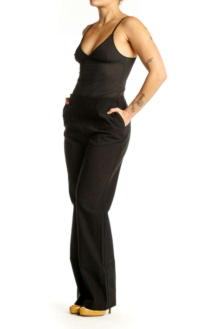 Black flare pants with high-waisted silhouette and stretchy fabric, front view
