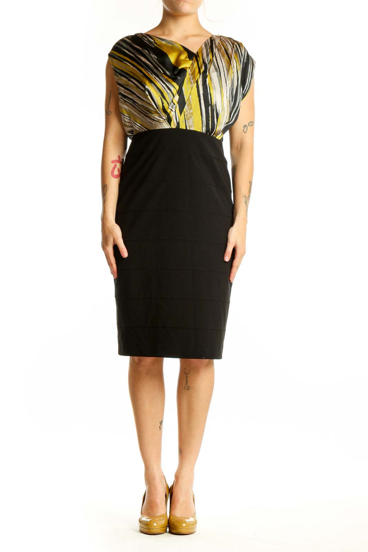 Black and gold striped wrap dress with color-block design, front view on model