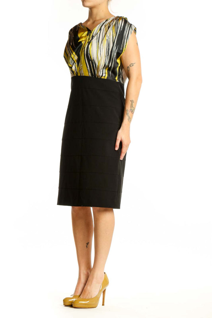 Black and gold striped wrap dress with color-block design, front view on model