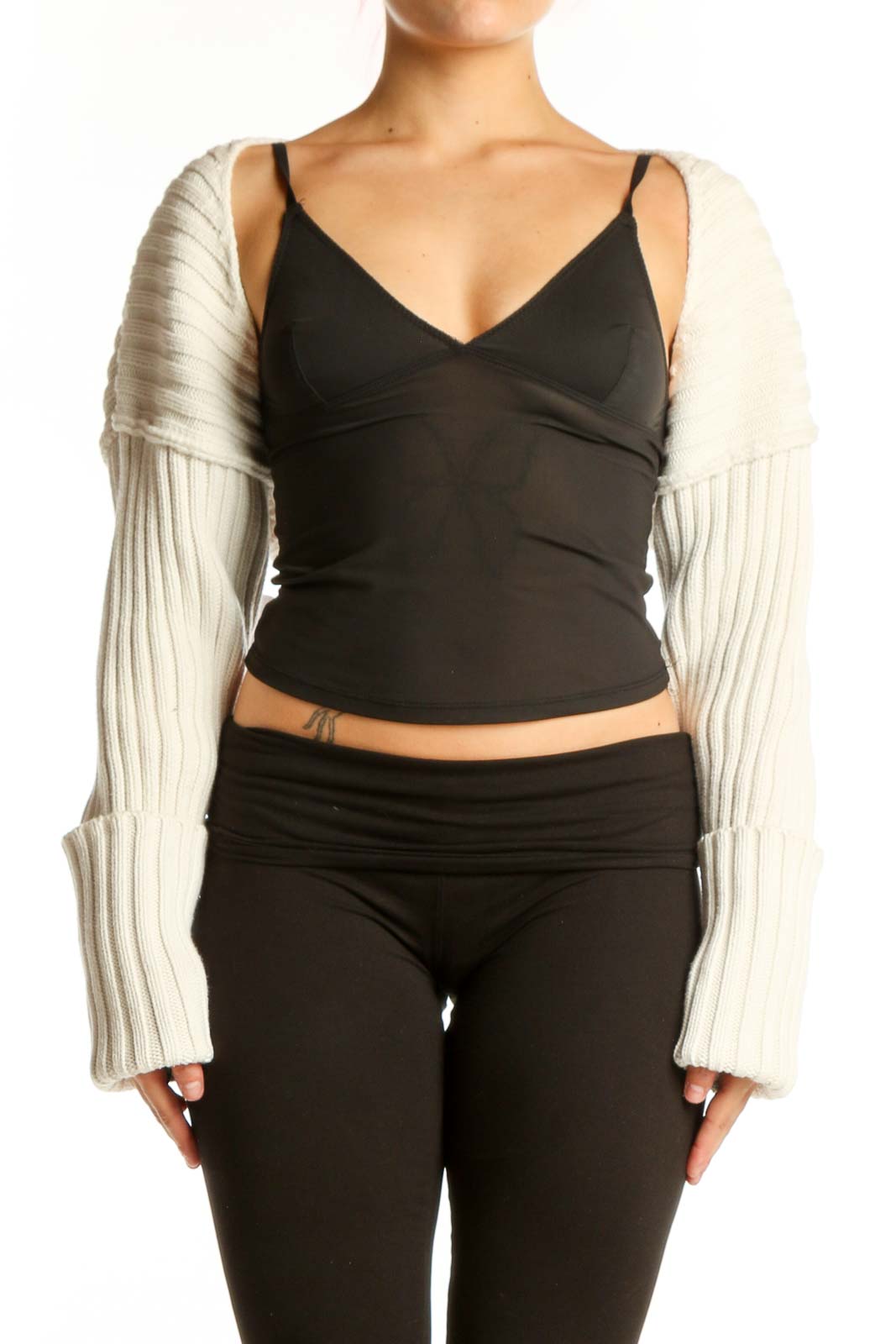 Black wrap crop top with cream ribbed knit sleeves, front view on model