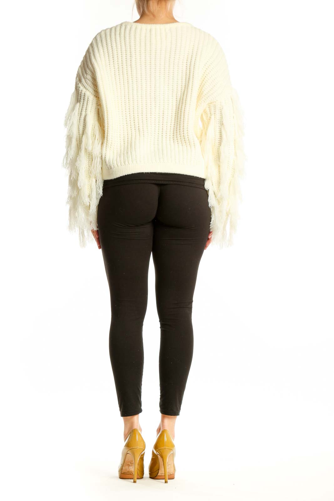 Back view of cream ribbed knit sweater with fringe sleeves, showing relaxed fit and cropped silhouette