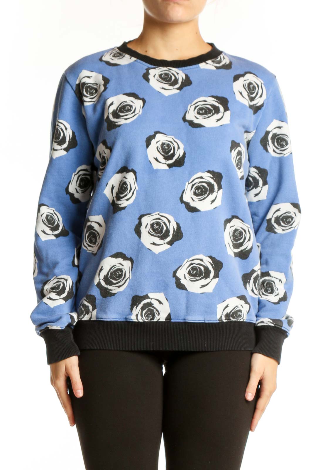 Blue cotton sweatshirt with black and white rose print and black ribbed crew neckline, front view