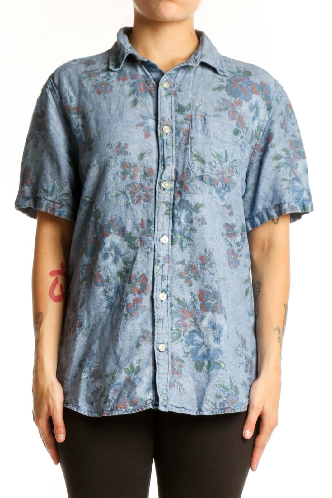 Blue floral button-up shirt with short sleeves and botanical print, front view