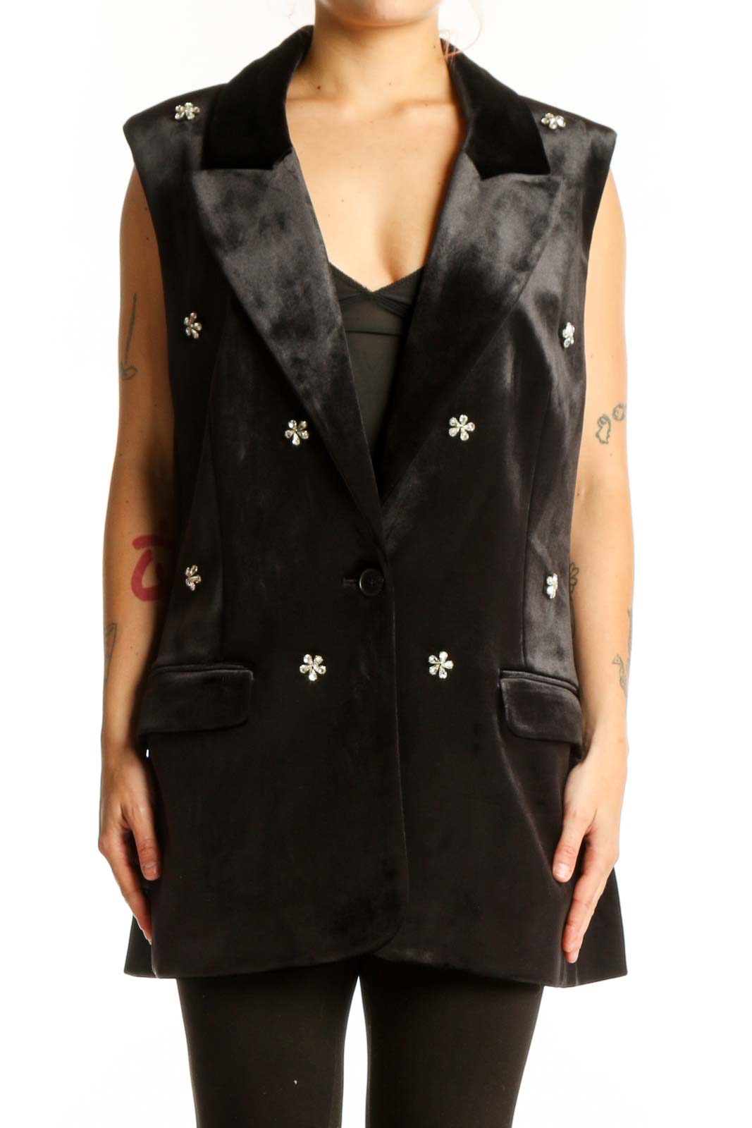 Black velvet blazer vest with silver snowflake embellishments, notched collar, and patch pockets, front view