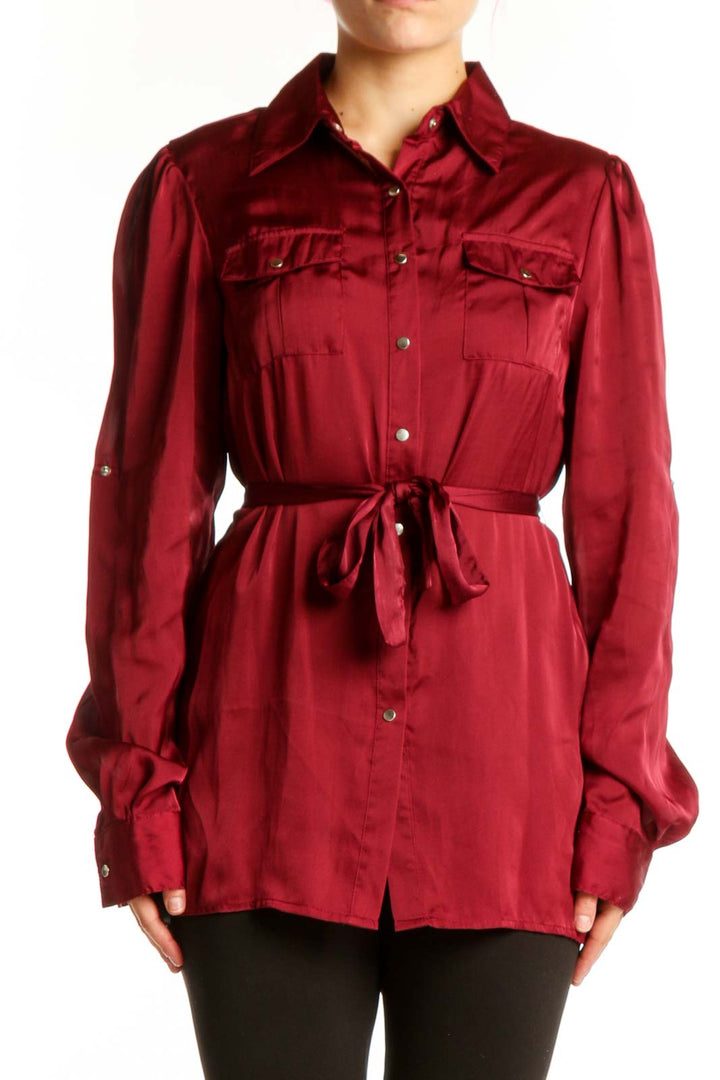 Burgundy button-up shirt with tie waist and chest pockets, front view