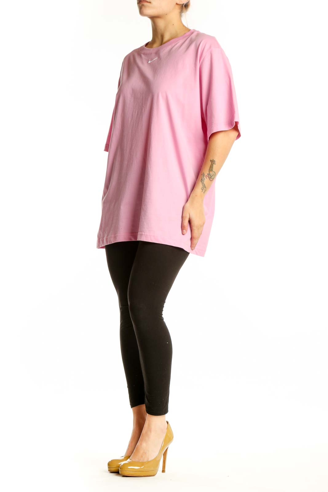Pink cotton Nike oversized t-shirt with Swoosh logo, front view on model