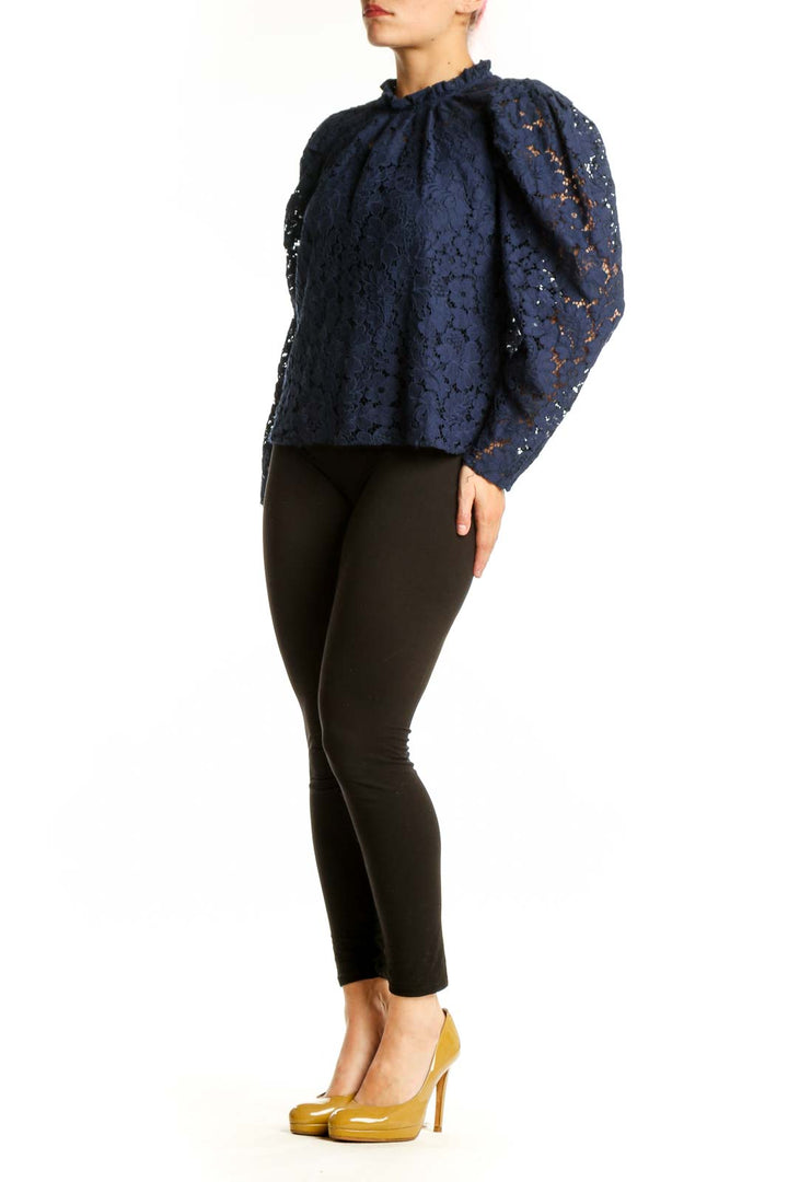 Navy lace puff sleeve top with intricate floral lace detailing and crew neckline, front view