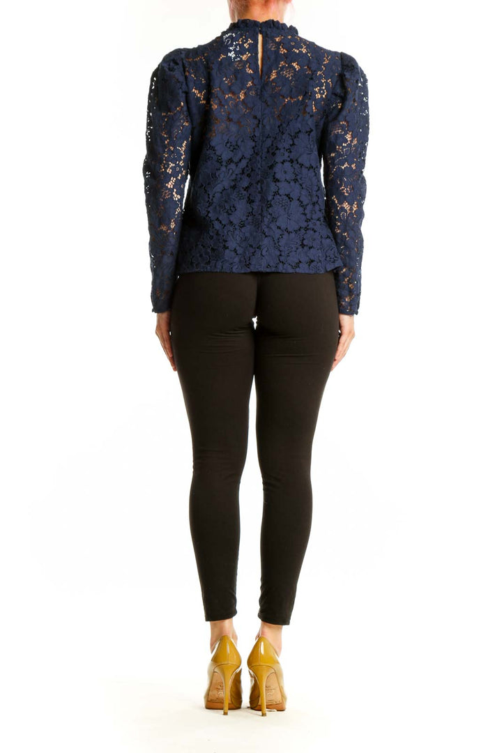 Navy lace puff sleeve top with cropped silhouette and lace sleeves, back view