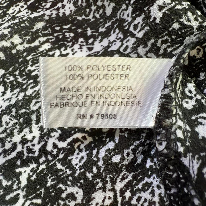 Gray speckled sleeveless button-front blouse by Violet & Claire, back view on model