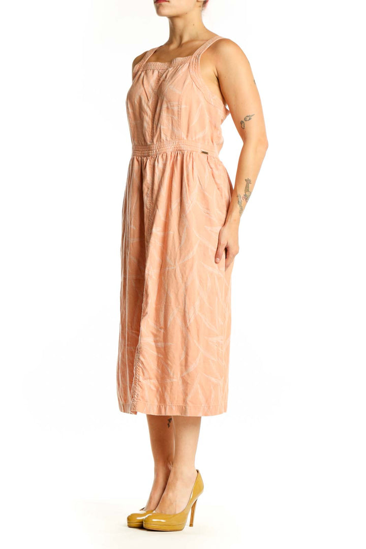 Front view of peach Tencel Lyocell midi dress with square neckline and defined waistband