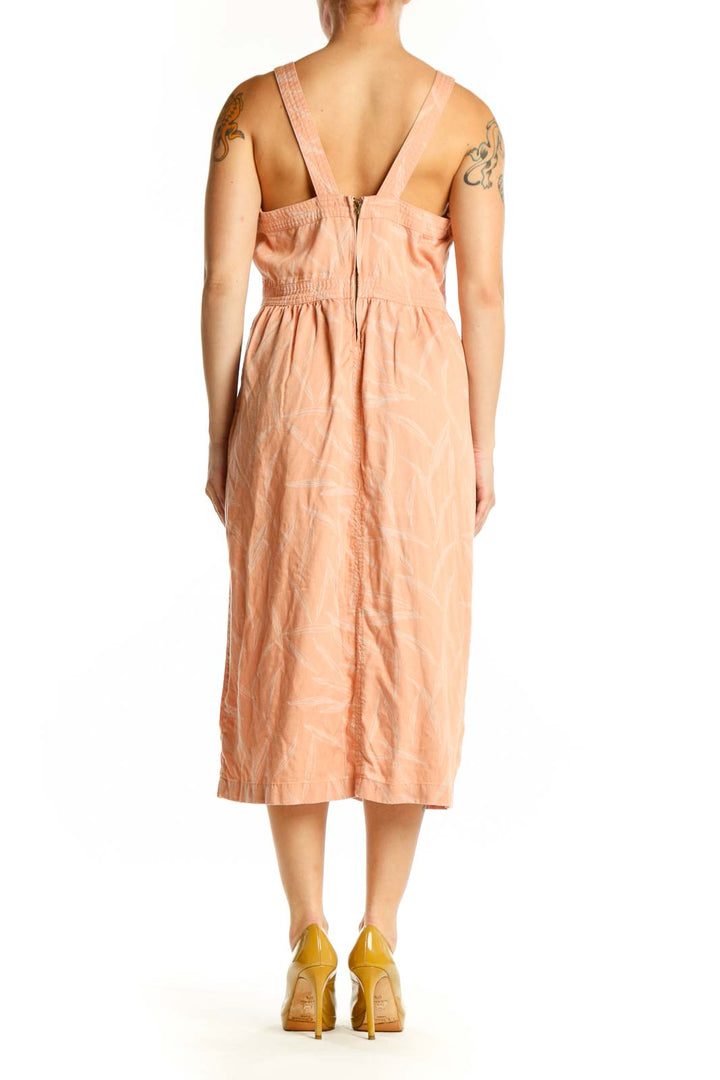 Back view of peach Tencel Lyocell midi dress showing relaxed A-line silhouette and sleeveless design