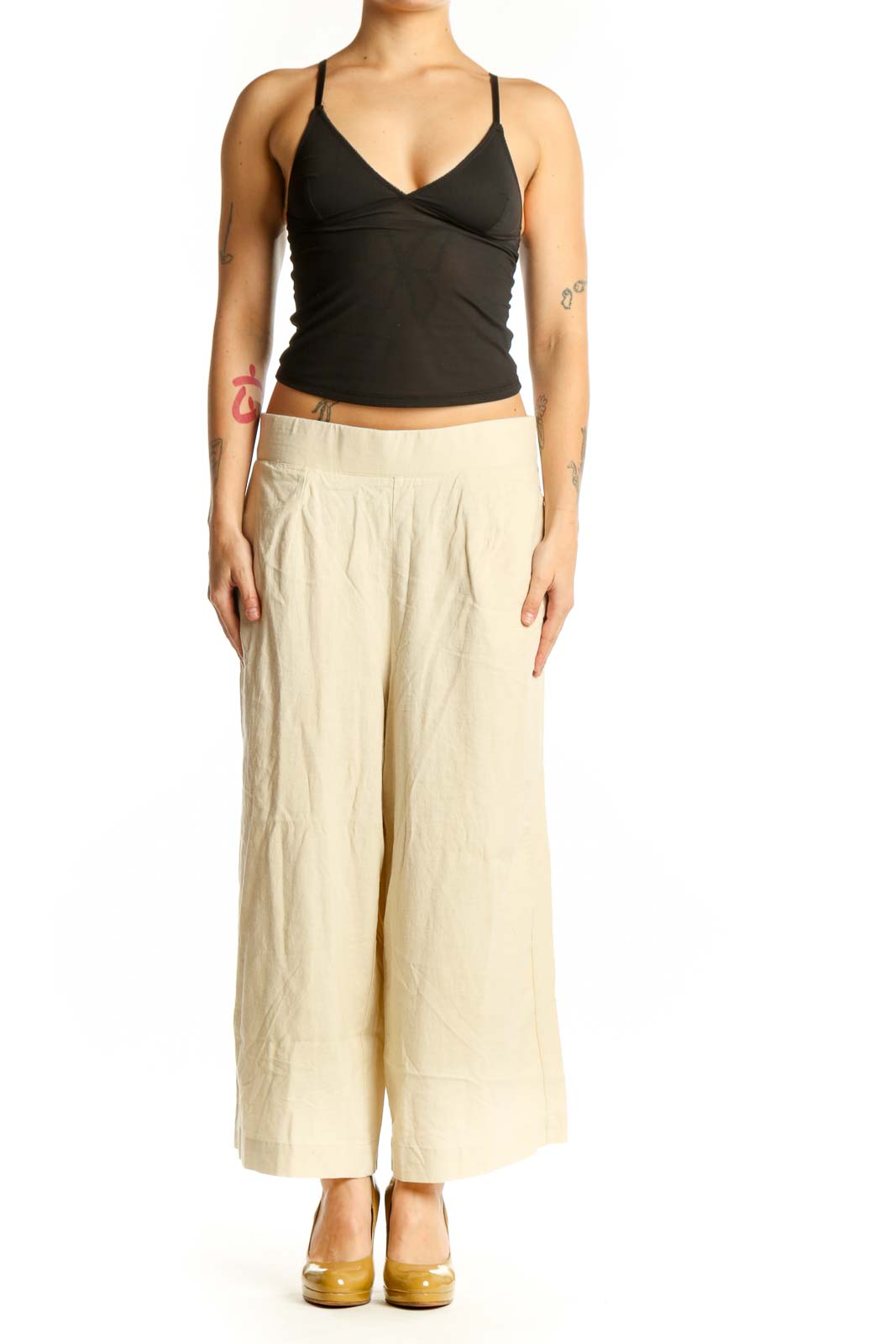 Front view of cream linen wide-leg cropped pants with elastic waistband and side pockets