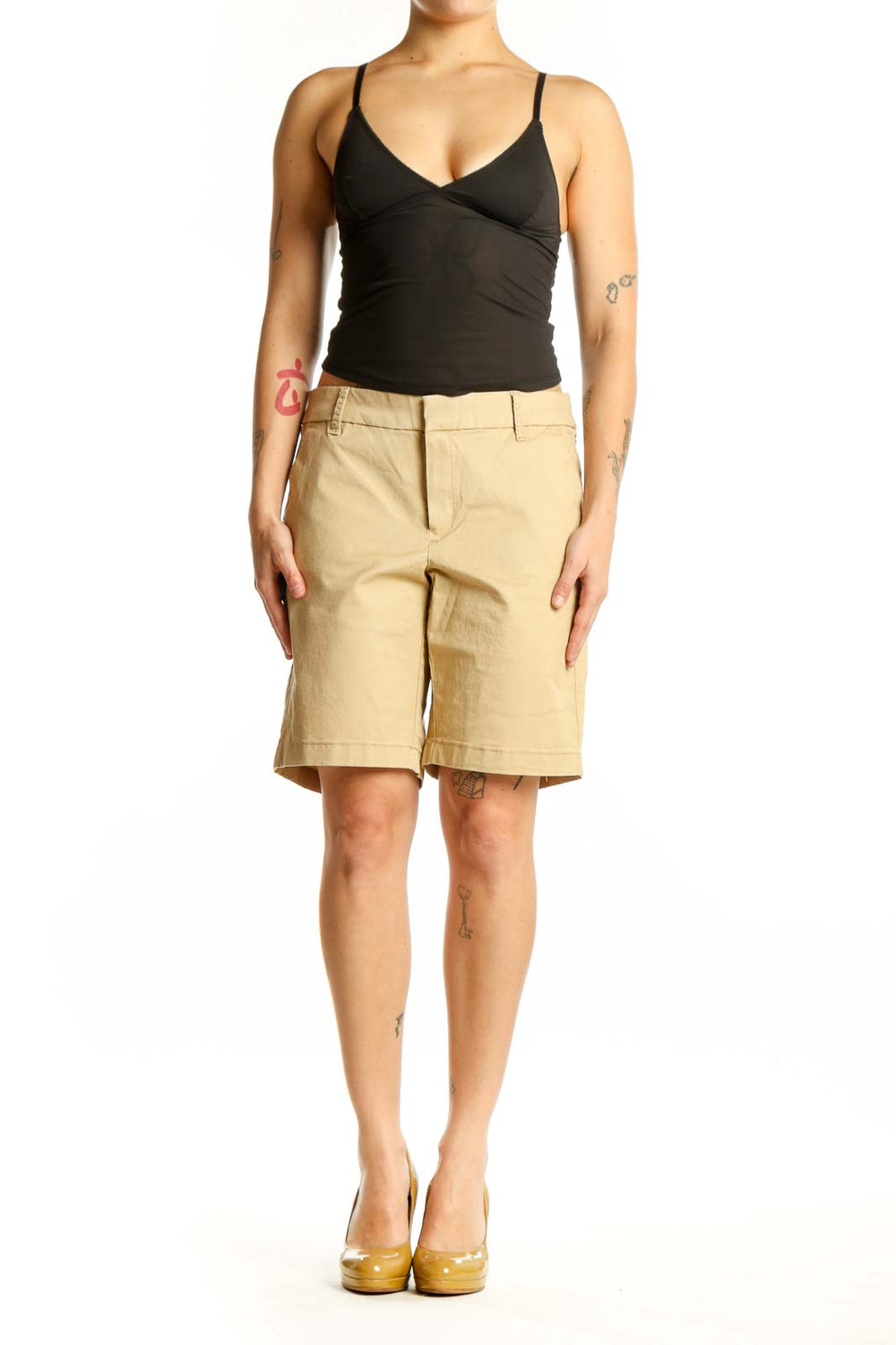 Front view of beige cotton Bermuda shorts with tailored fit and front pockets