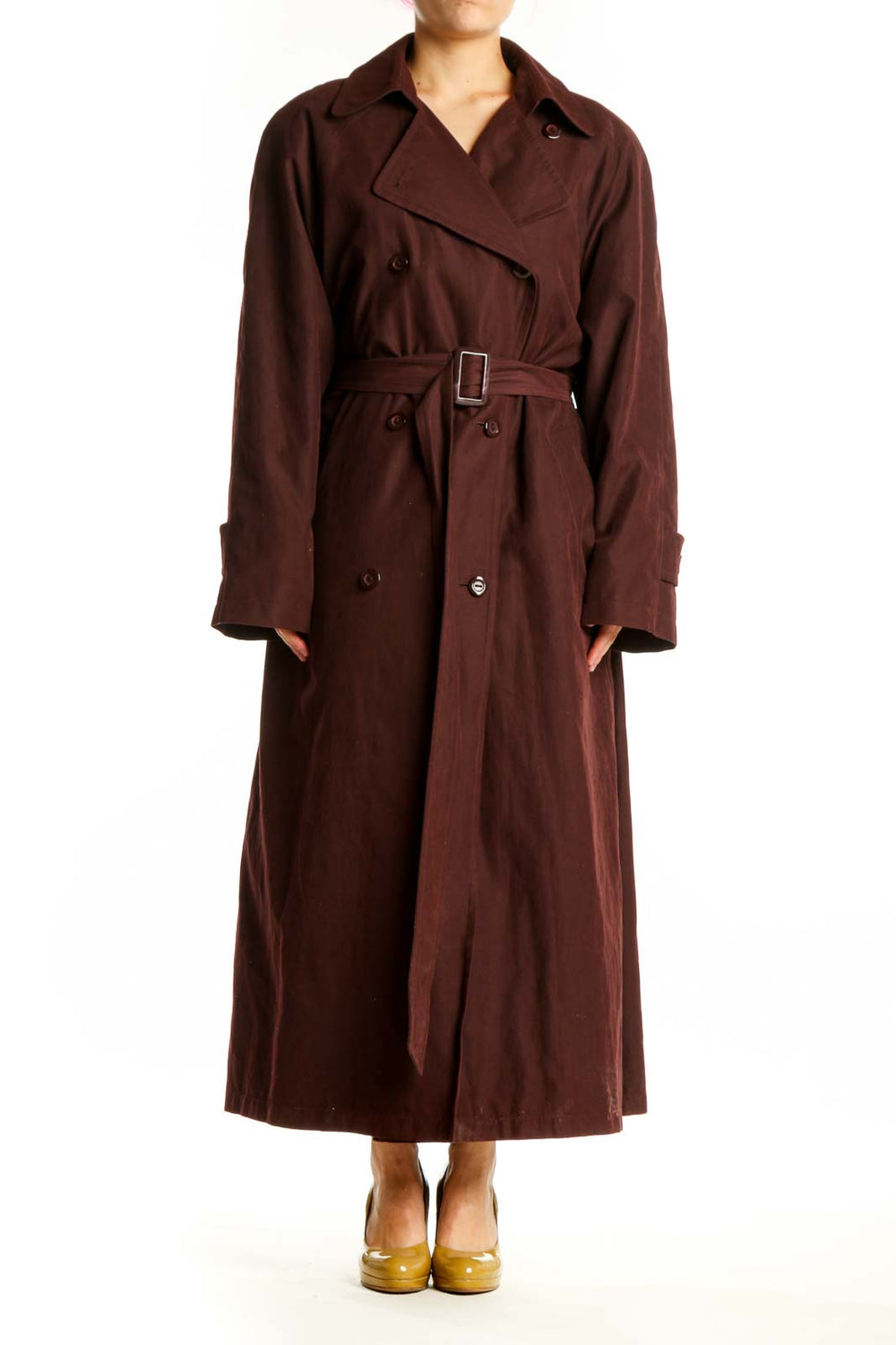 Burgundy double-breasted trench coat with adjustable belt and rolled cuffs, front view