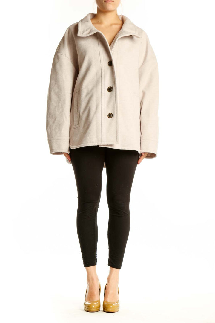 Cream polyester button-up jacket with collar and dark brown buttons, front view on model