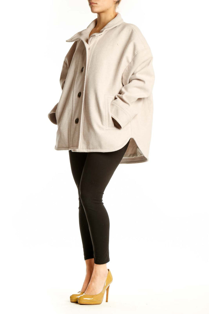 Cream polyester button-up jacket with collar and dark brown buttons, front view on model