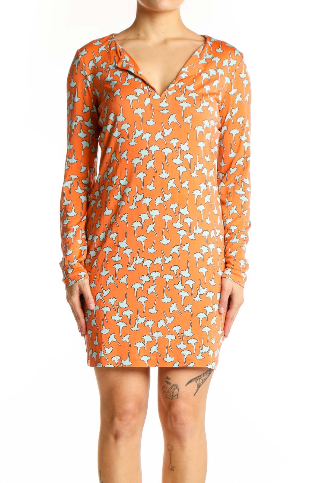 Orange floral silk wrap dress with white botanical print, V-neckline and long sleeves, front view
