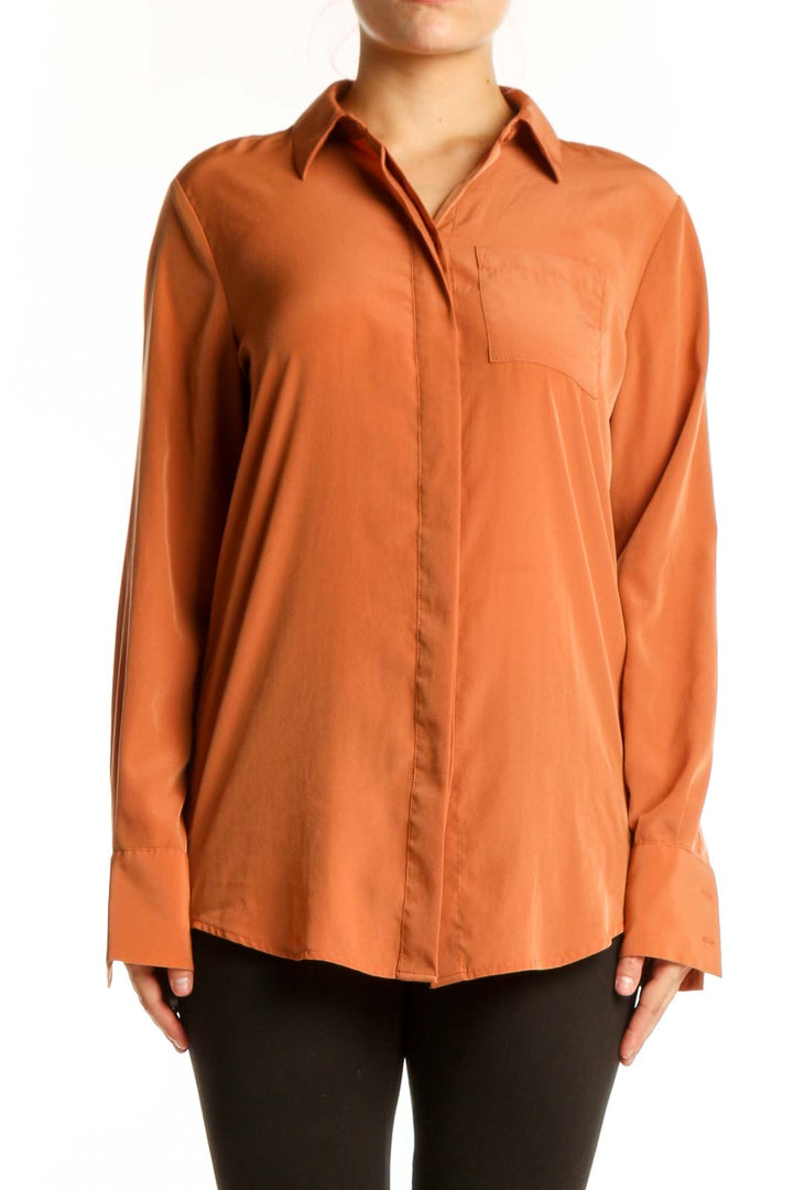 Nine West orange polyester button-up shirt with collared neckline and chest pocket, front view