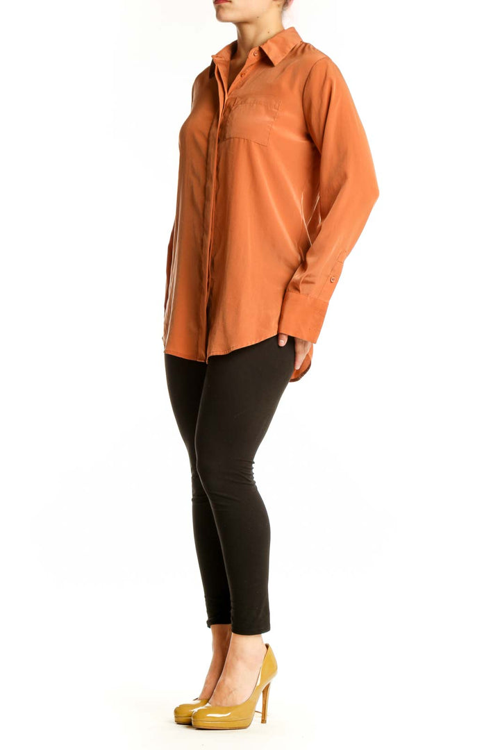 Nine West orange polyester button-up shirt with collared neckline and chest pocket, front view
