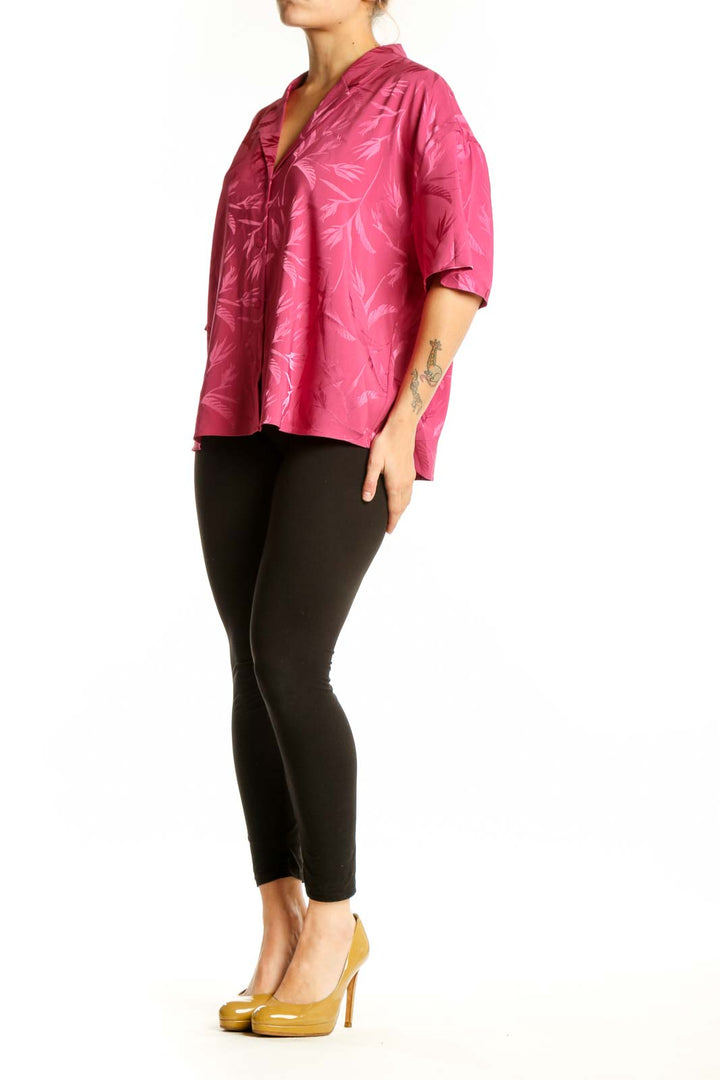 Pink floral ruffle button-up blouse with jacquard leaf pattern, front view on model