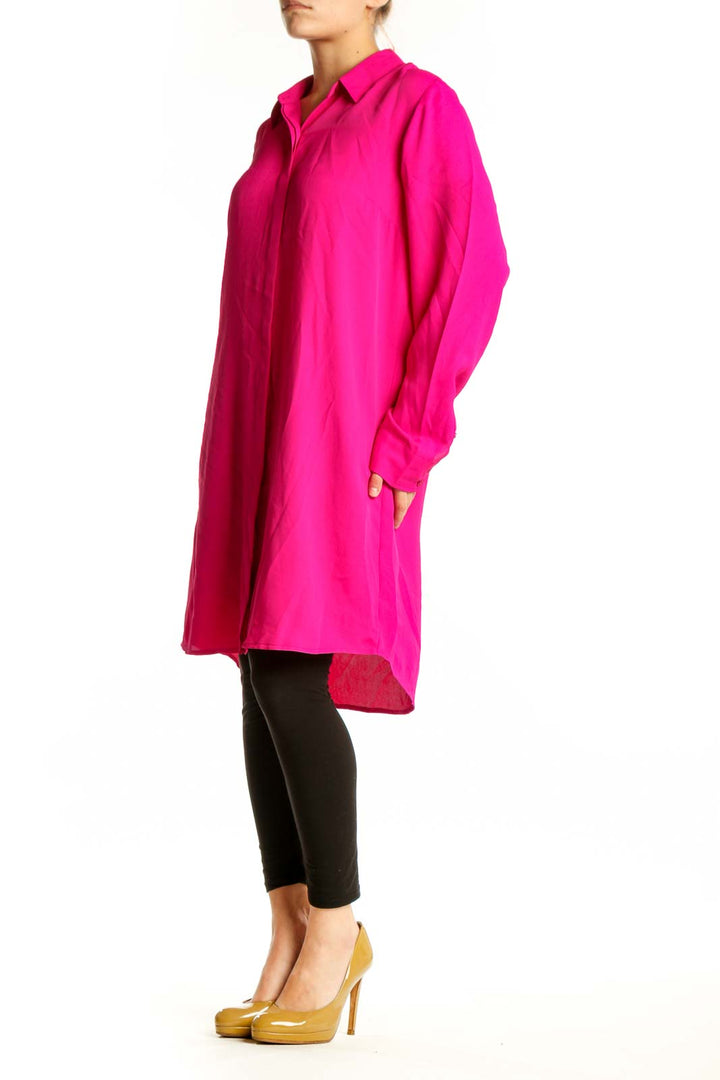 Front view of pink button-front shirt dress with collared neckline and long sleeves