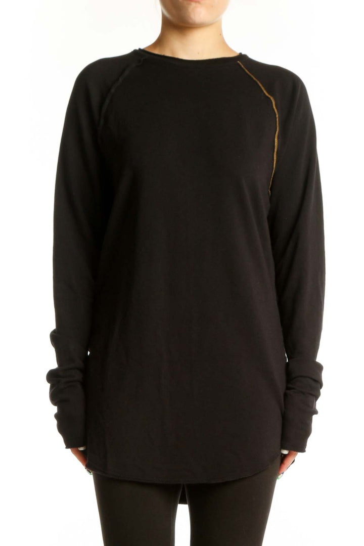 Black long sleeve tunic dress with gold piping detail and thumbhole cuffs, front view