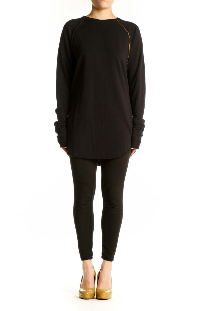 Black long sleeve tunic dress with gold piping detail and thumbhole cuffs, front view