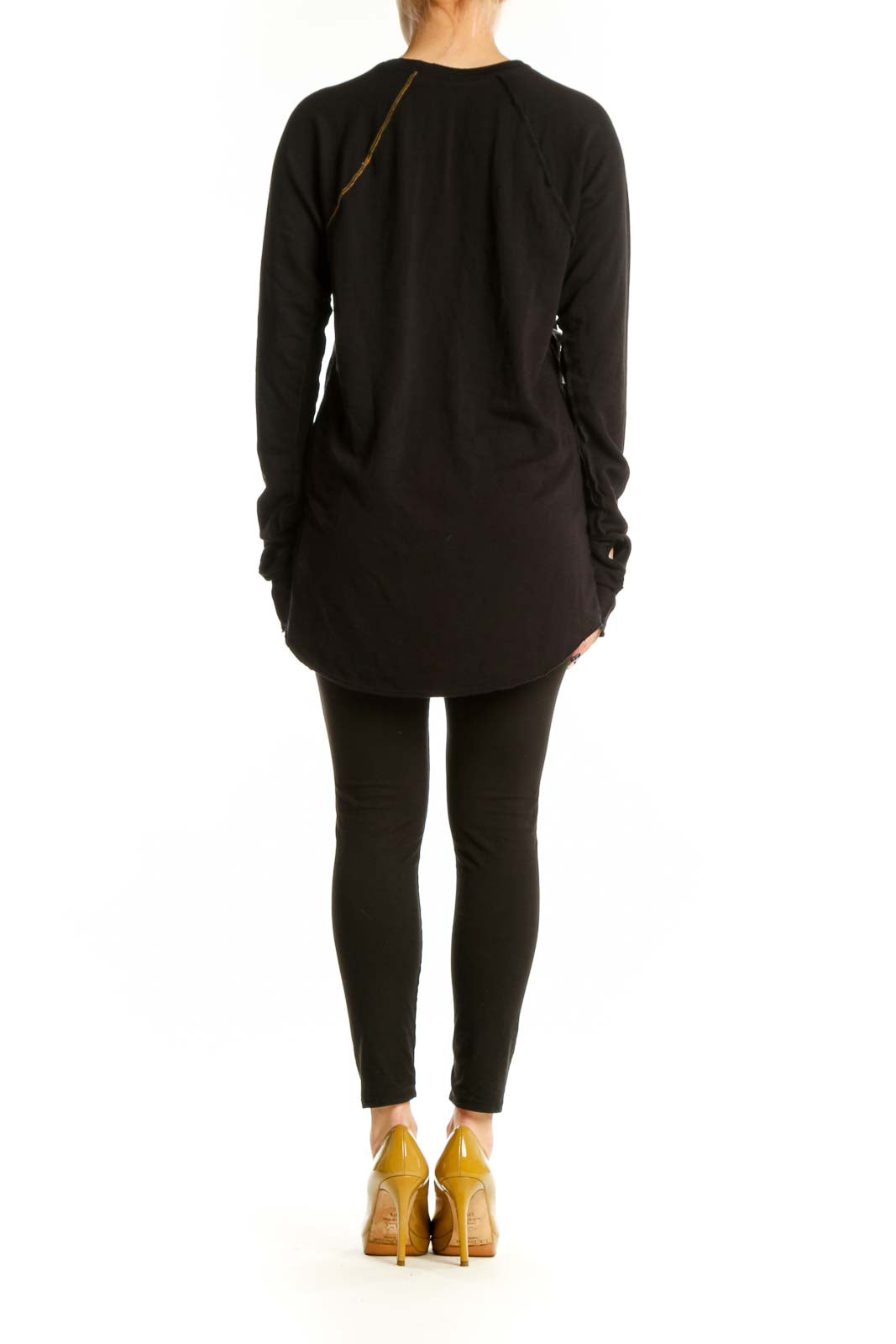 Black long sleeve tunic dress with gold side seam piping, back view styled with black leggings