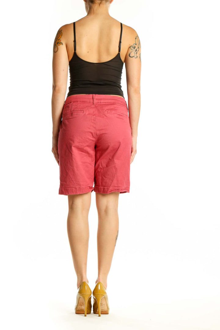 Red cotton bermuda shorts back view showing pocket detail and flattering silhouette