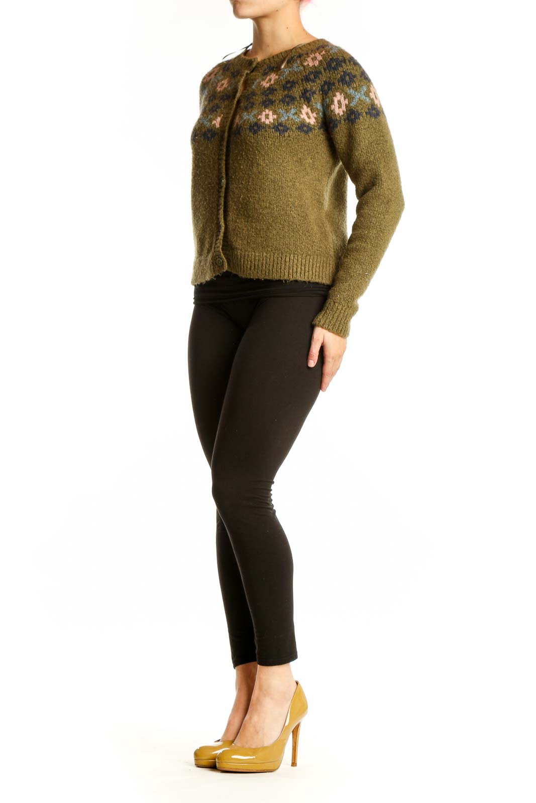 Olive green Fair Isle cardigan with cream and navy patterned yoke, button-front closure, worn with black pants