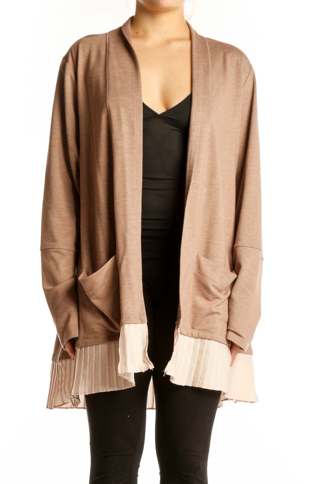 Beige open-front cardigan with pleated cream hem worn over black top, front view
